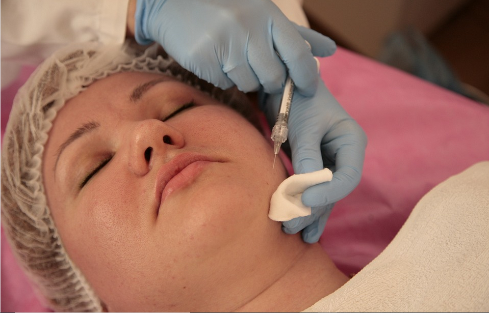 a dermatologist attending a patient